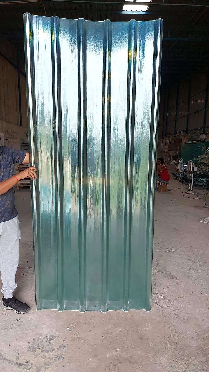 Translucent green FRP skylight roofing sheet held upright in the factory